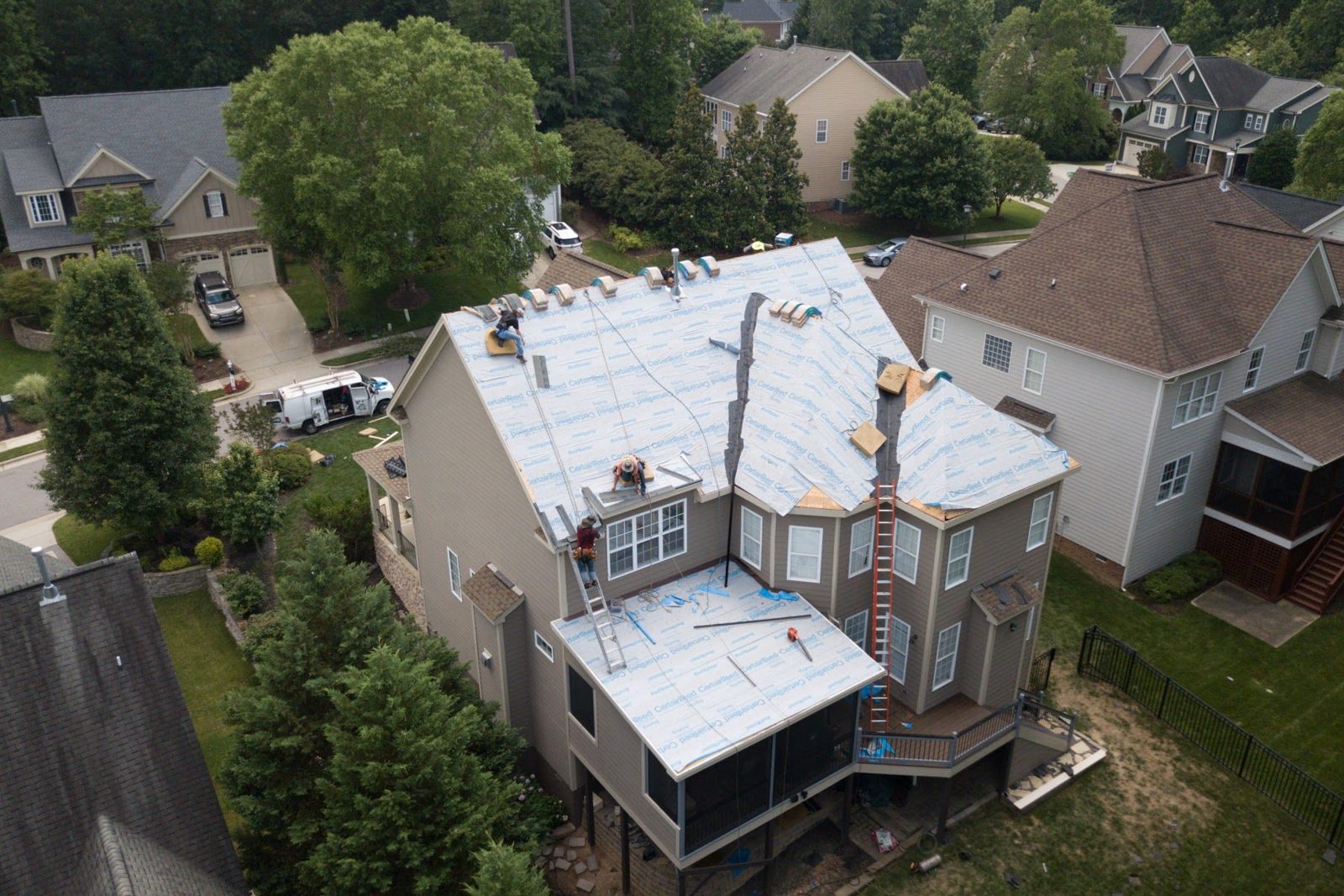 Aerial view of a metal roof installed by Melvin's Roofing