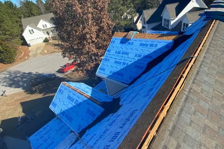 New synthetic underlayment and drip edge during a roof repair