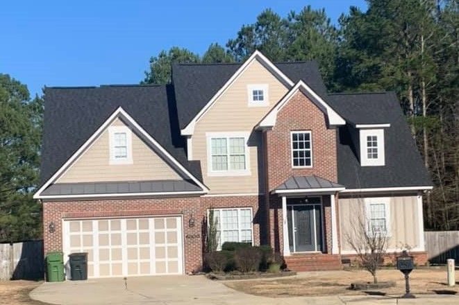 Two-story home with a new architectural shingle roof